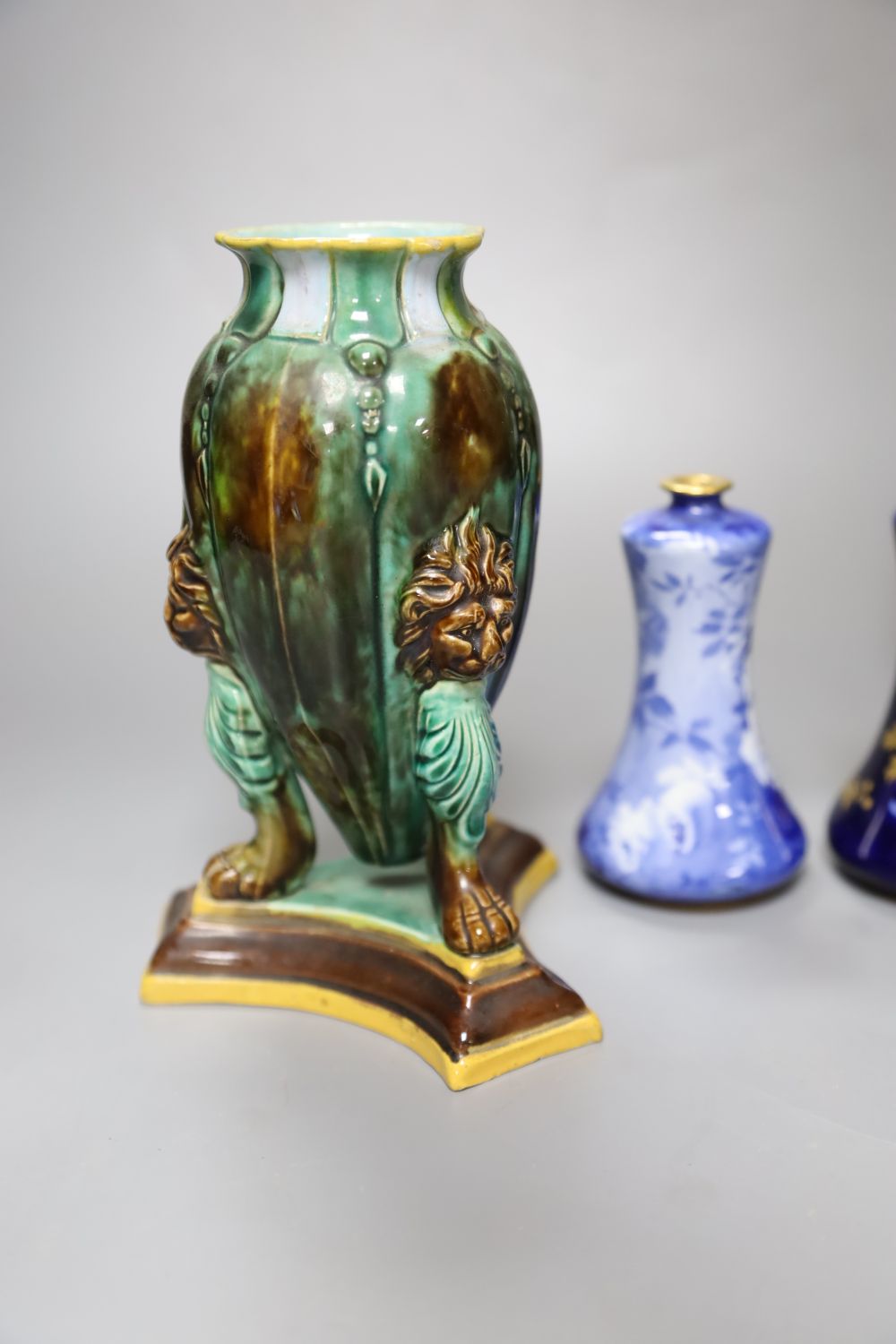 A pair of Victorian majolica vases, height 16cm and two Doulton Burslem Corolian ware miniature vases, height 11cm